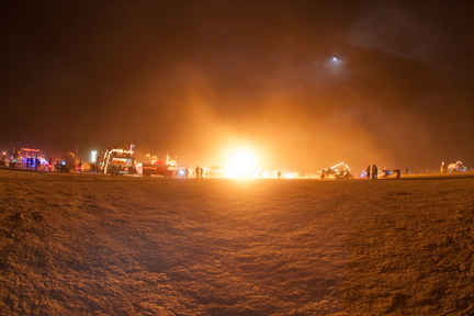 Playa at night lit up by random fire